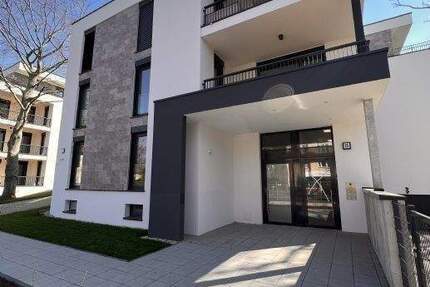 NEUBAU mit 5-Zimmern BLICK in den AUENWALD 70m² WOHNEN 2 x TERRASSEN KAMIN 2 x TG-SP ca. 7.000m² eingezäunter Gemeinschaftsgarten 5 zimmer